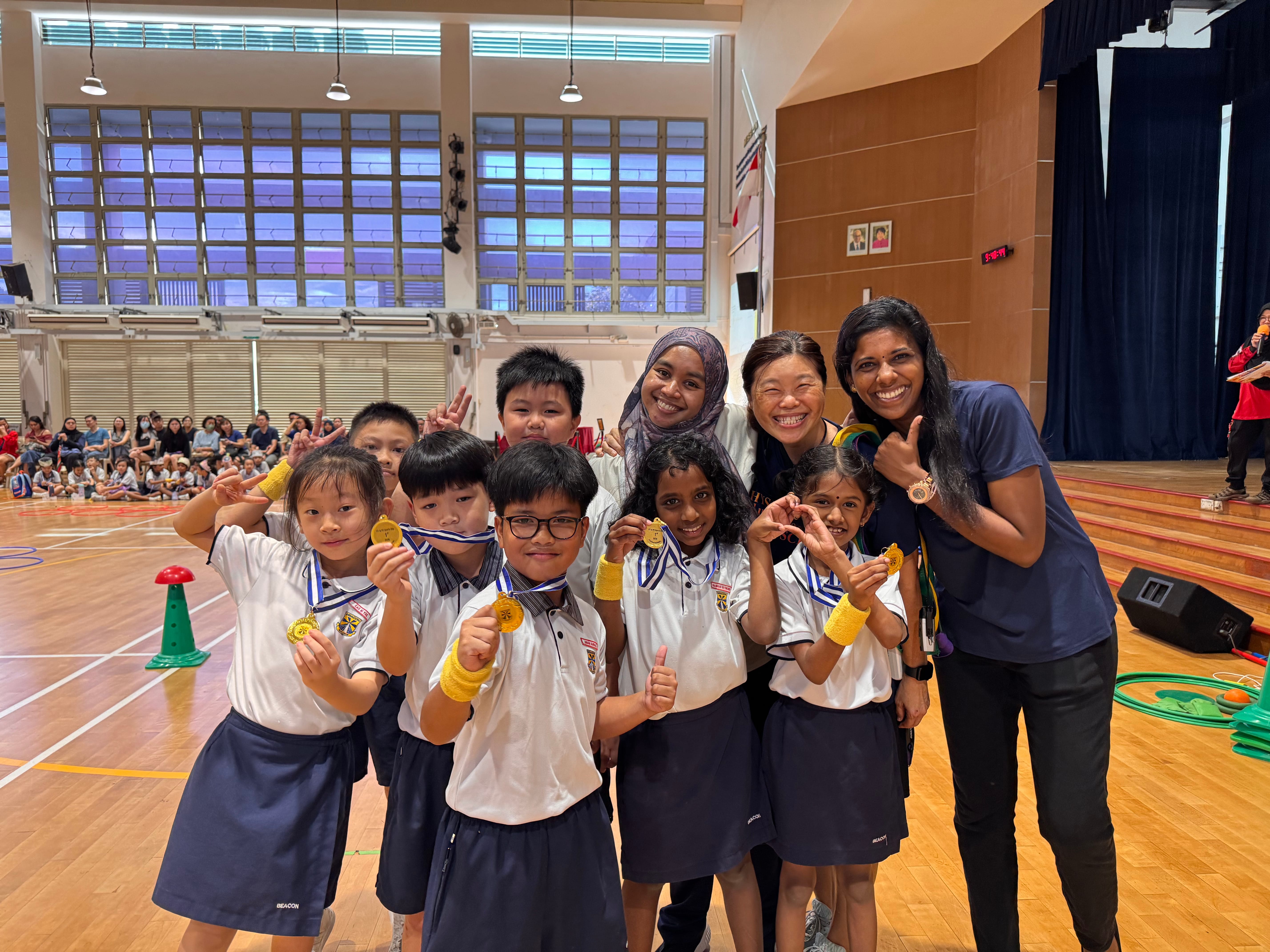 Students celebrating their success with their teachers